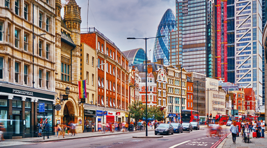 London skyscrapers behind a street of houses and shops